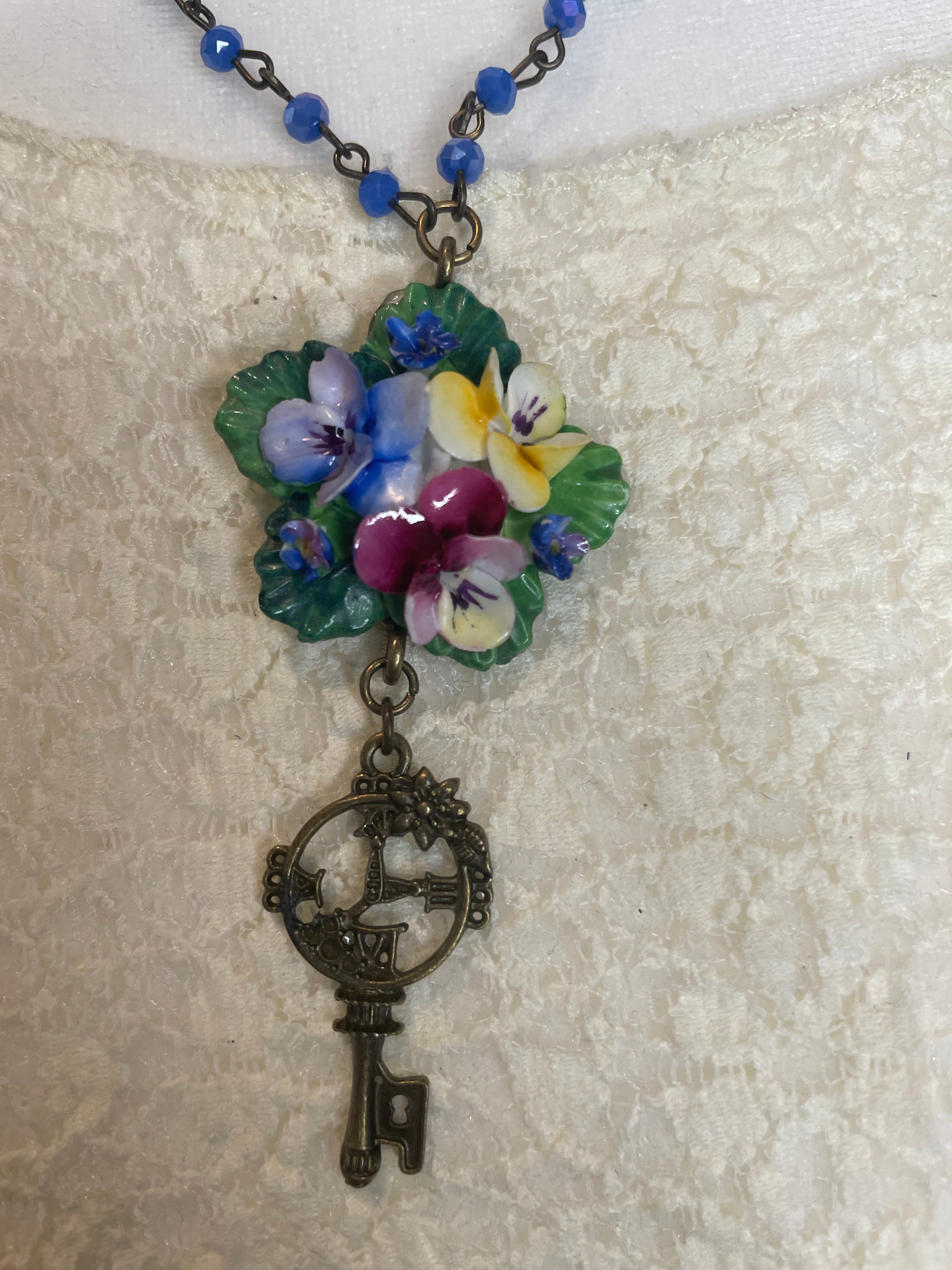 Porcelain Pansy Cluster With a Key Dangle Necklace by Gina