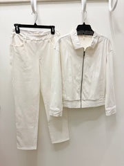 Escape Knit denim white two-piece clothing set consisting of straight-leg jeans and a cropped zip-up jacket, hanging on black hangers against a plain white wall.