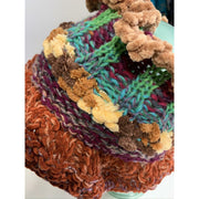 detail of infinity hand knit scarf (1.) with turquoise accent